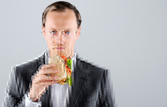 unhappy-businessman-eating-a-sandwich.jpg